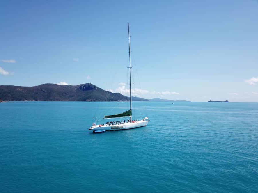 Airlie Beach: 2-Night Whitsundays Sailing Trip with Meals - Sunset, blue lights, and stars after dark