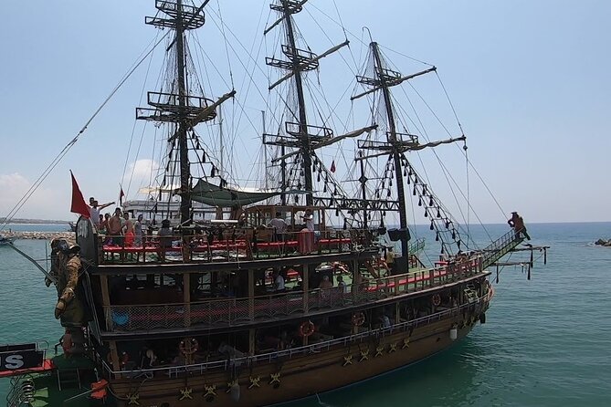 Alanya Catamaran Boat Tour with Lunch, Soft Drinks & Transfer - Leaving Alanya Marina for the Coast
