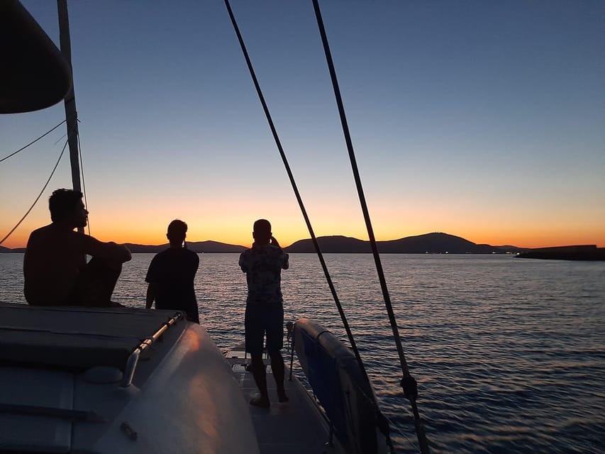 Alghero catamaran sunset tour Alghero - Sailing beside Alghero’s old walls
