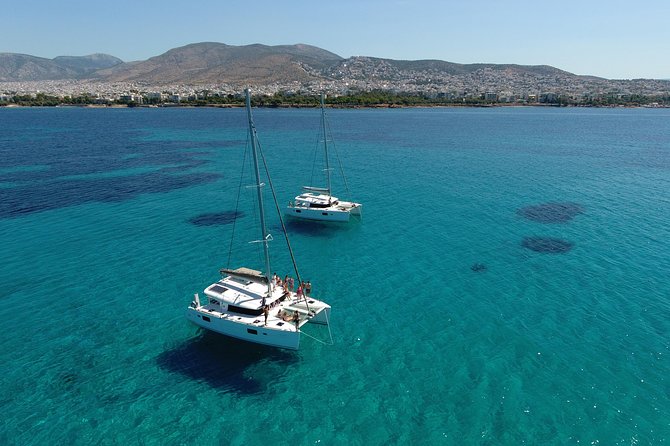 Athens Private Luxury Catamaran Cruise with Traditional Greek Meal and BBQ - First swimming stop and time in the water