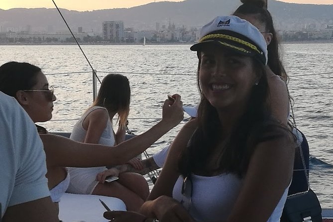 Authentic Barcelona Sailing Tour with Swim & Drinks - A small boat and a wide view of Barcelona