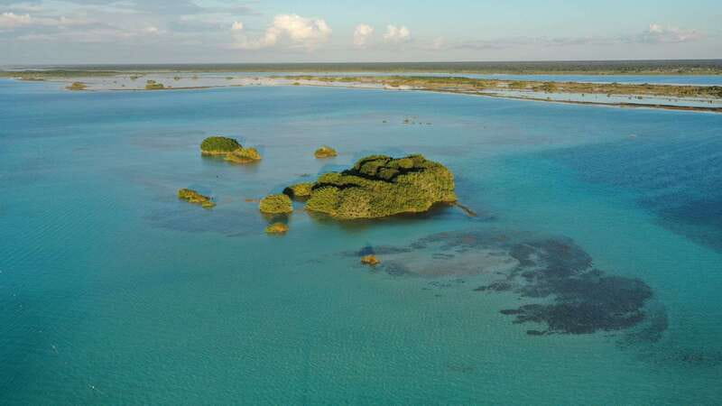 Bacalar: Group Sailing Trip with Swimming and Drinks - Cenote Negro and the lagoon’s changing colors