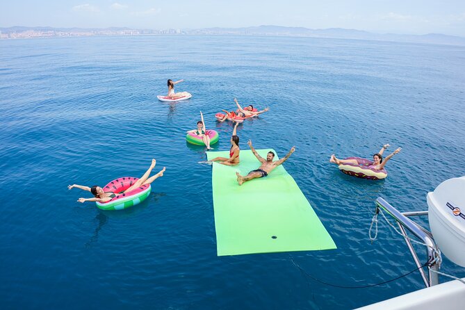 Barcelona Catamaran Cruise with Tapa & Drink Included - Daytime sail: swimming, sun, and a chance to get wet