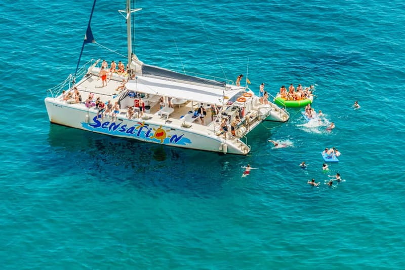 Barcelona: Catamaran Party Cruise with BBQ Meal - The Badalona swimming stop is short but refreshing
