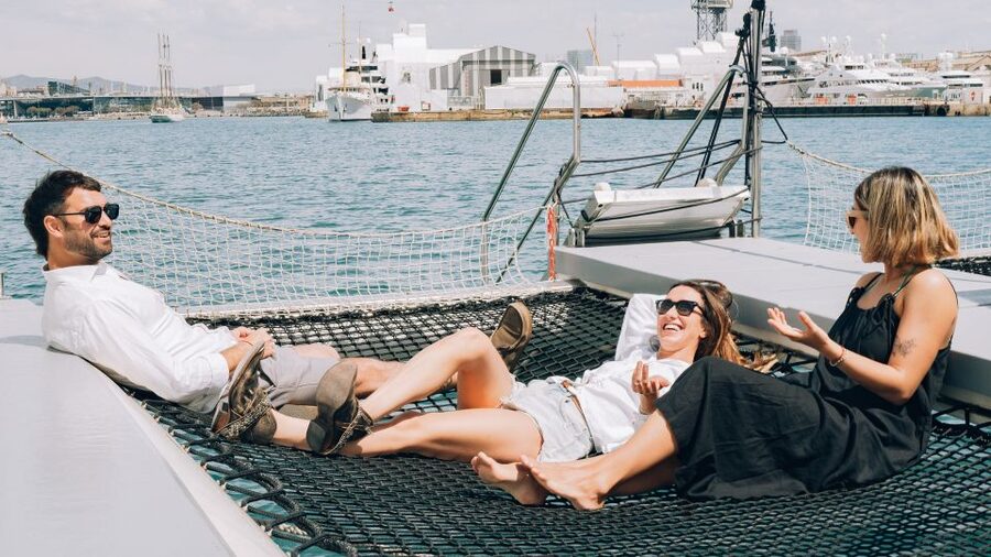 Barcelona: Daytime or Sunset Catamaran Cruise with Music - Music, drinks, and the evening atmosphere