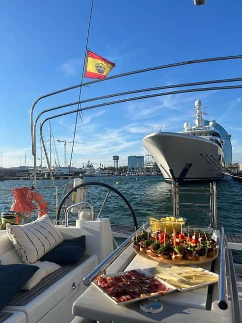 Barcelona: Sailing Tour + Food, Drinks, Swim & Sunset Option - Barcelona’s beach frontage from the water