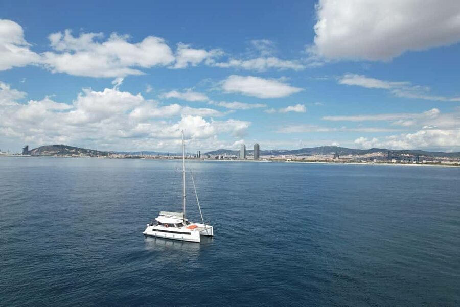 Barcelona: Shared cruise on a catamaran Drink+Local Tapa - Following the coast past La Barceloneta