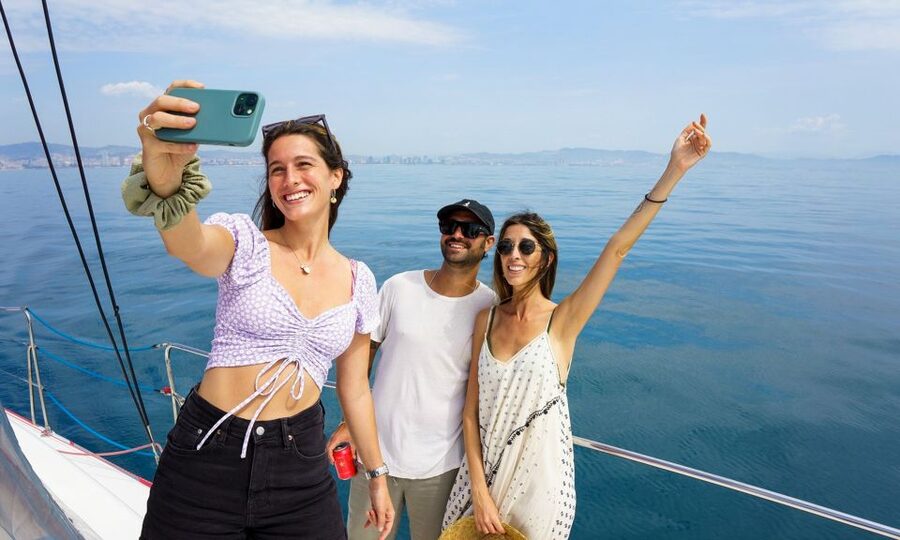 Barcelona: Sunset or Day Catamaran Cruise with Tapa & Drink - Leaving Marina Vela beside Barceloneta