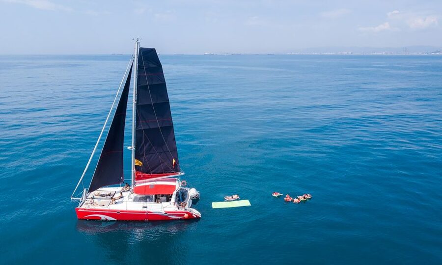 Barcelona: Sunset or Day Catamaran Cruise with Tapa & Drink - The daytime route and its 30-minute swim stop