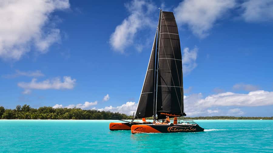 Bora Bora: Sunset Catamaran Cruise with Snacks and Drinks - Leaving your hotel dock by speedboat