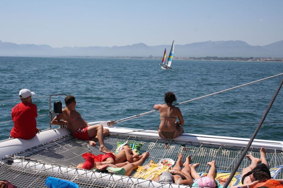 Cambrils: Costa Dorada Catamaran Day Cruise with BBQ Lunch - Crew service, music, and the mood onboard