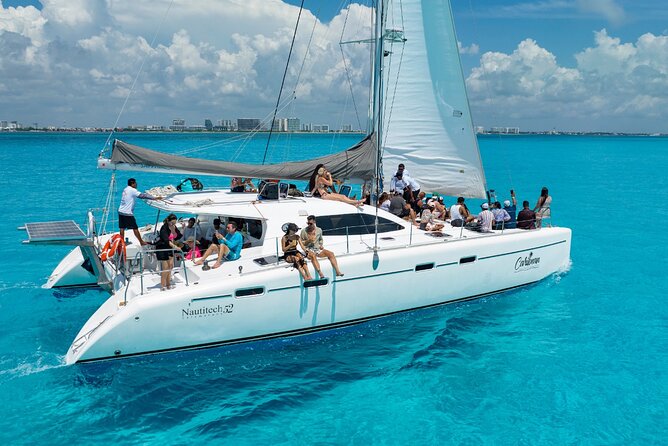 Cancun Catamaran: Isla Mujeres, Snorkeling, Drinks & Buffet Lunch - The Catamaran Ride Across the Caribbean