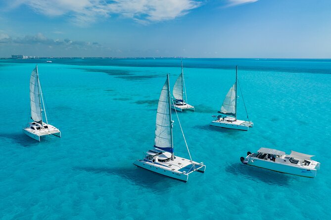 Cancún Catamaran to Isla Mujeres + Snorkel, Open Bar & Lunch - A Catamaran Day with a Party Beat