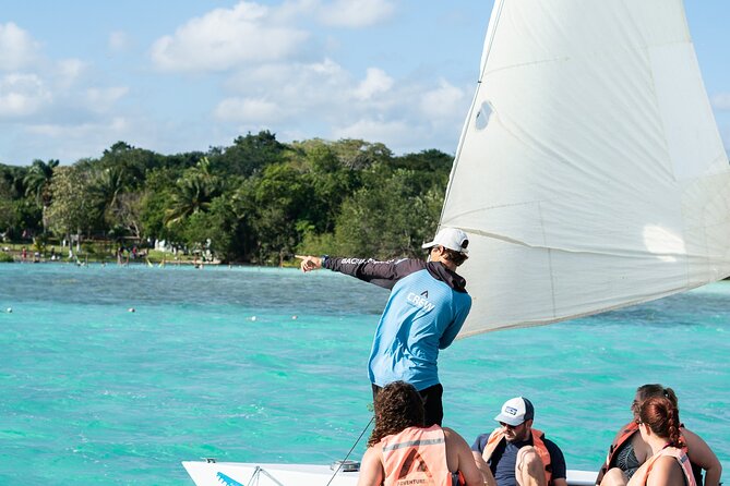 Catamaran Adventure: Navigate the Seven Colors - Reading Bacalar’s Seven Colors from the deck