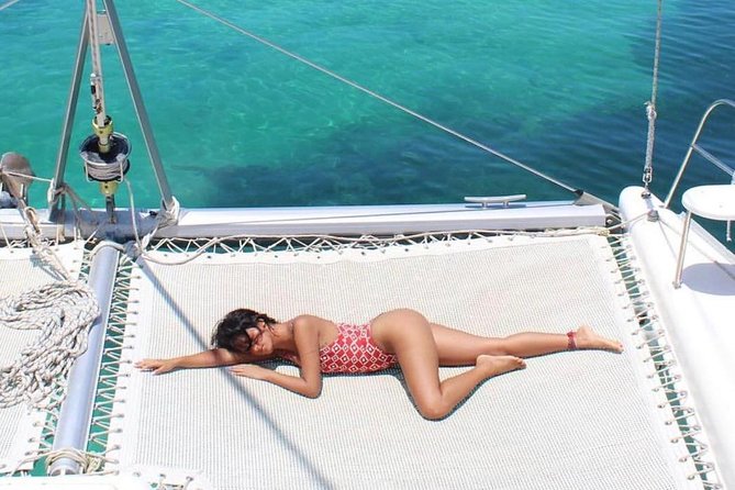 Catamaran adventure to Isla Mujeres with Snorkel,Buffet,Open Bar and Beach Club - Sailing from Cancun on a busy Caribbean morning