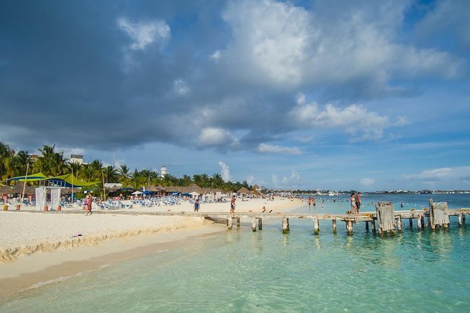 Catamaran adventure to Isla Mujeres with Snorkel,Buffet,Open Bar and Beach Club - A possible golf-cart add-on and an important safety note