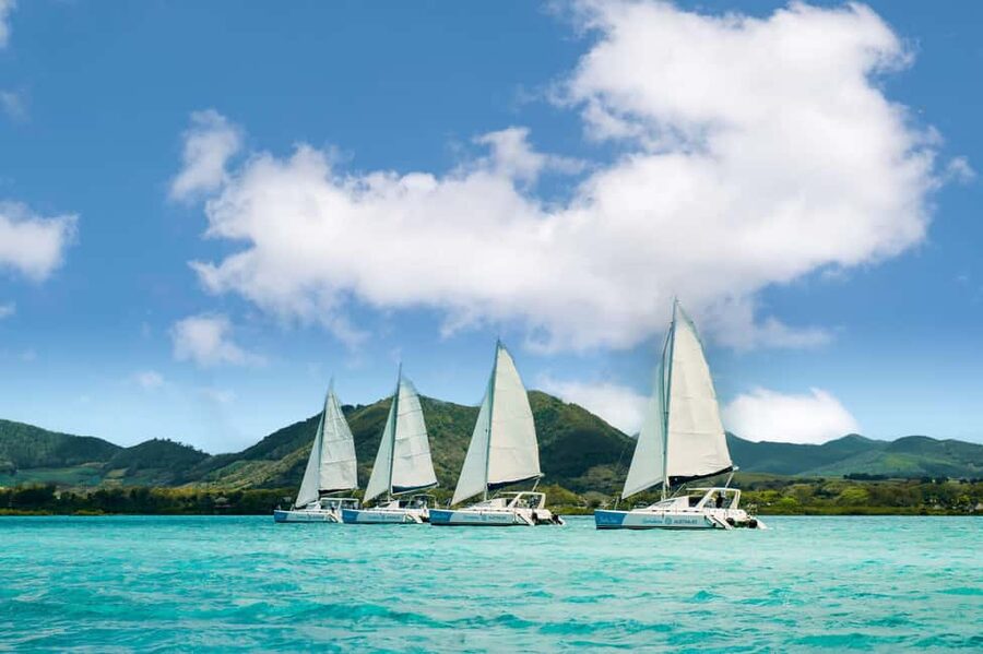 Catamaran Cruise to île aux Cerfs w Dolphins watch & Lunch - Sailing east through Mauritiuss turquoise lagoons