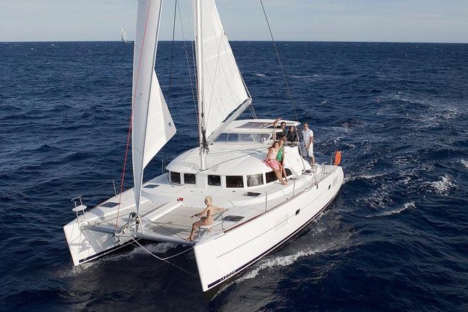 Catamaran Day & Sunset Cruises with meals Drinks and transportation - Leaving Tourlos Port with Mykonos behind you
