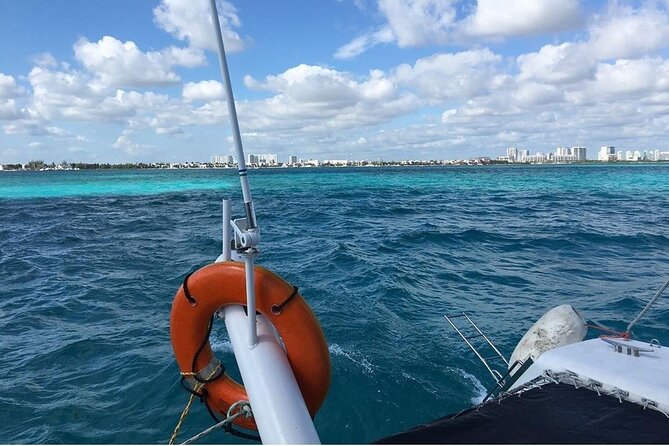Catamaran to Isla Mujeres, Open bar, buffet, Beach Club Included - Reef snorkeling with a large group