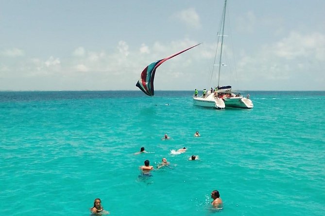 Catamaran to Isla Mujeres, Open bar, buffet, Beach Club Included - What the price includes, and what it does not