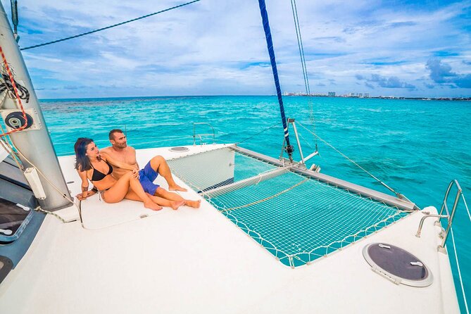 Catamaran to Isla Mujeres Snorkeling Tour with Open Bar and Lunch - Catamaran sailing, drinks, and optional thrills