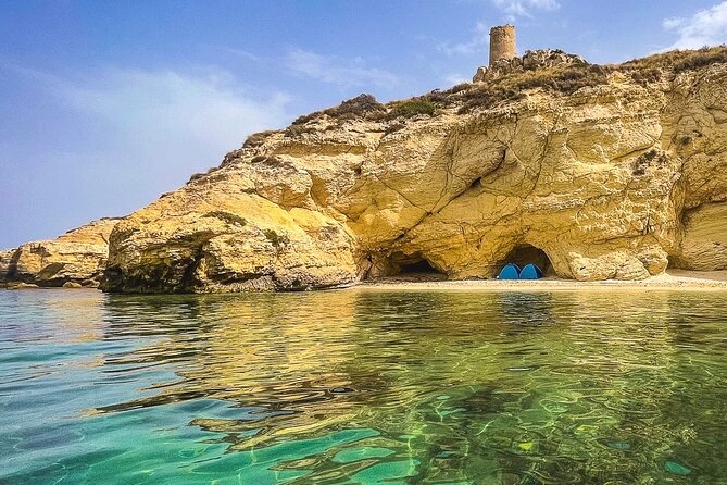 Catamaran tour stops bathing and snorkeling toast with prosecco - Cala Mosca beneath the lighthouse