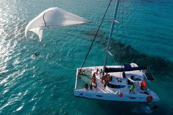 Catamaran Tour to Isla Mujeres, Open bar, Lunch, Snorkeling, Beach Club Included - El Meco Reef and the short snorkeling stop