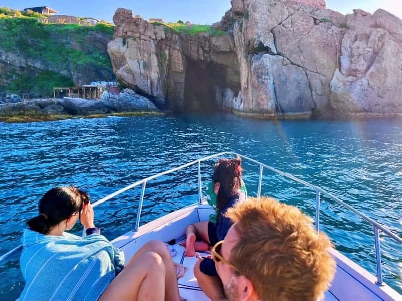 Cefalù: Mini Yacht Tour with Caves, Snorkeling, and Open Bar Aperitif - Cefalù’s pier and boardwalk from offshore