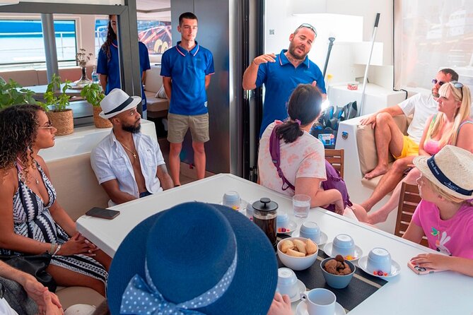 Chania: Morning Catamaran Cruise with Premium Lunch & Drinks - What the crew adds to the experience