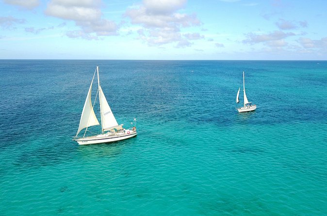 Coral Sunset Sail with 3 Course Dinner in Aruba - Sailing past Nikki Beach and the cruise ship area
