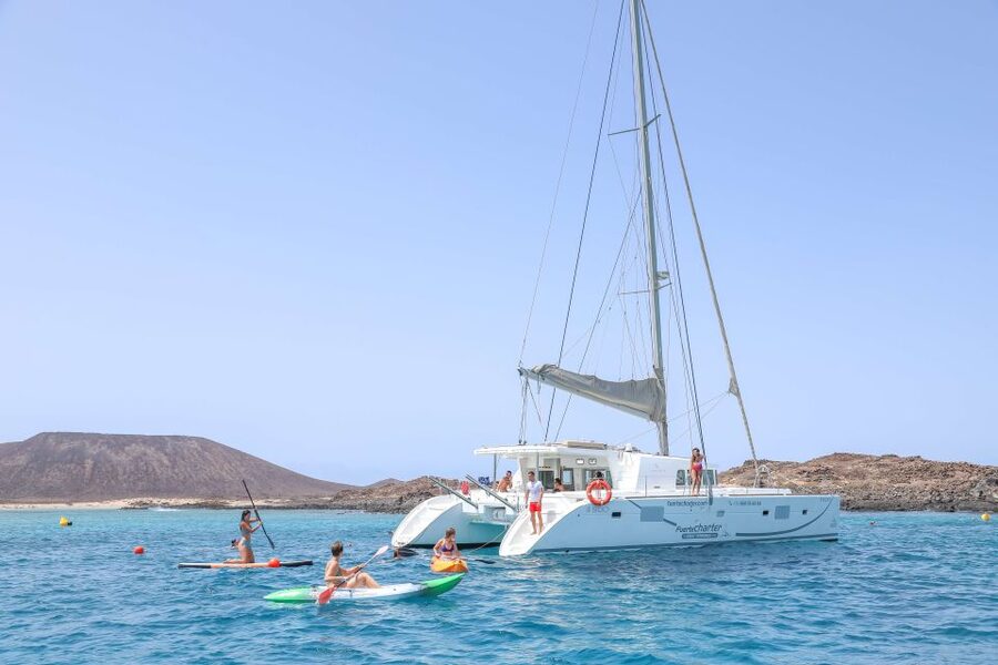 Corralejo: Adults-Only Catamaran Day Trip to Lobos Island - Sailing from Corralejo toward the volcanic Lobos coast