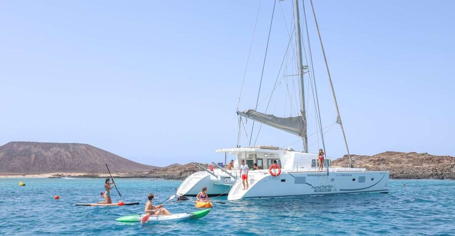 Corralejo: Adults-Only Catamaran Day Trip to Lobos Island - Lunch arrives with paella, fruit, and Cava