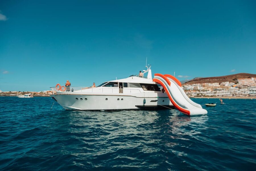 Costa Adeje: Private Yacht Trip with Watersports and Slides - Cruising toward Palm Mar and the southern coast