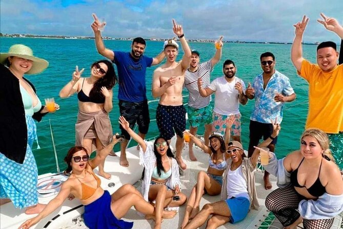 Deluxe Catamaran to Isla Mujeres, with Drinks, Snorkel & Buffet - Spinnaker flying depends on the weather