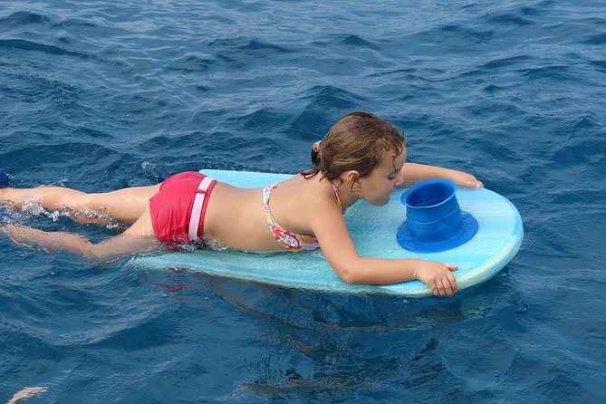 Deluxe Snorkel & Dolphin Watch Aboard a Luxury Catamaran from Kailua-Kona - More than snorkeling: slides, jumps, and floating toys
