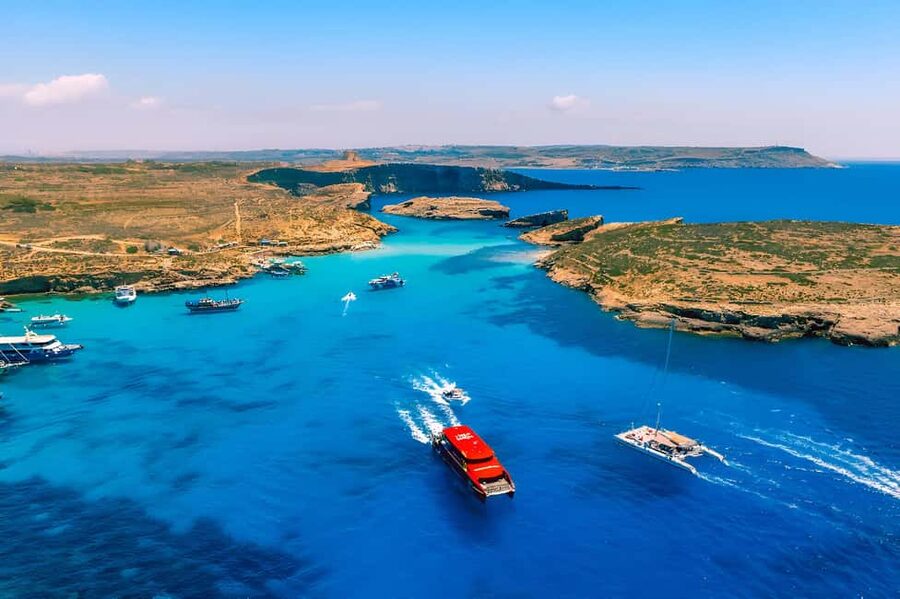 Evening Catamaran Ferry Cruise To The Blue Lagoon - From Sliema Ferries to Comino at sunset