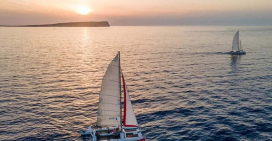Fornells: Catamaran Sunset Cruise of Menorca's Coast - Sailing out from Fornells as the light softens