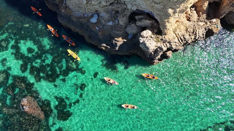 From Lagos: Ponta da Piedade Caves Kayak Tour from Catamaran - Swimming, sun, and the boat slide