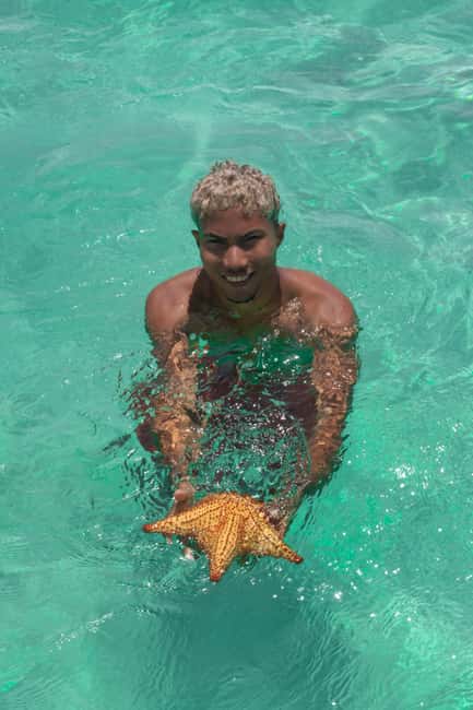 From Punta Cana: Catamaran Tour to Saona Island with Open Bar and Buffet - Catamaran comfort, music, and the possible boat change