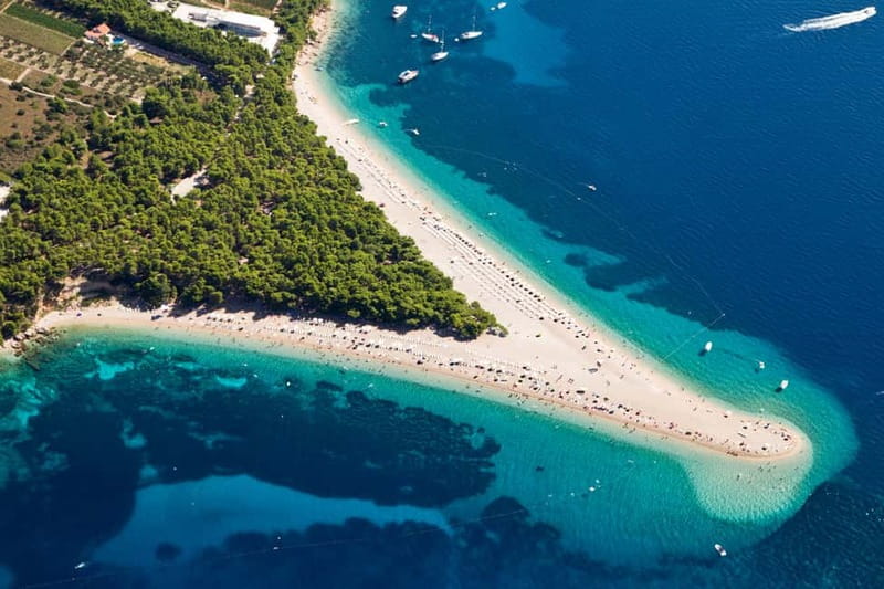 From Split: Catamaran Cruise to Golden Horn & Brač island. - Lunch, vineyards, and the south coast cruise
