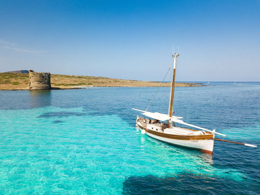 From Stintino: Asinara Vintage Sailing Boat Tour with Lunch - Cala del Bianco and the final swim
