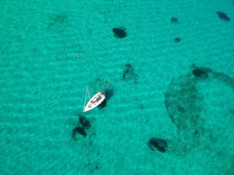 From Stintino: Half-Day Sailing Boat Tour to La Pelosa - First swim stop: clear water and natural pools