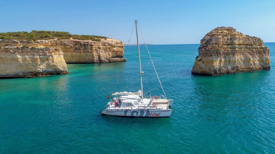 From Vilamoura: Sunset Catamaran Experience - The Algarve cliffs and caves from the water