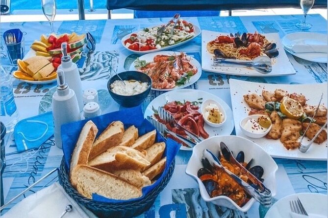 Half-Day Exclusive Catamaran Cruise in Santorini with Meal and Open Bar - Is the sunset departure worth choosing?