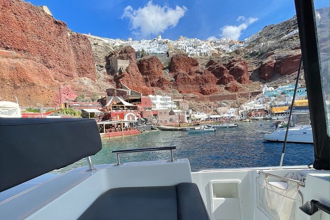 Half Day Premium Catamaran Cruise in Santorini including Oia - Limestone formations and clear water