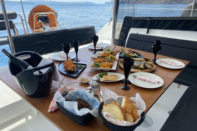 Half Day Premium Catamaran Cruise in Santorini including Oia - Food, drinks, and the onboard mood