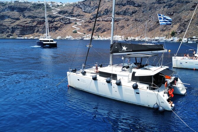 Half Day Premium Catamaran Cruise in Santorini including Oia - Red Beach: striking colors and a quick swim