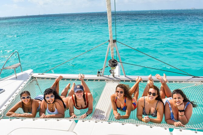 Isla Mujeres Catamaran Tour with Snorkel, Open bar and Transport - Who gets the best value from $85, plus fees