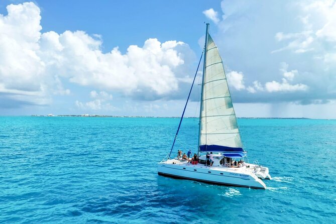 Isla Mujeres: Catamaran Tour with Snorkeling Food, Drinks, Beach - Beach-club time, buffet food, and extra costs