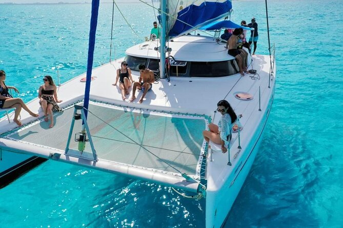 Isla Mujeres: Catamaran Tour with Snorkeling Food, Drinks, Beach - Sailing with drinks and a party atmosphere
